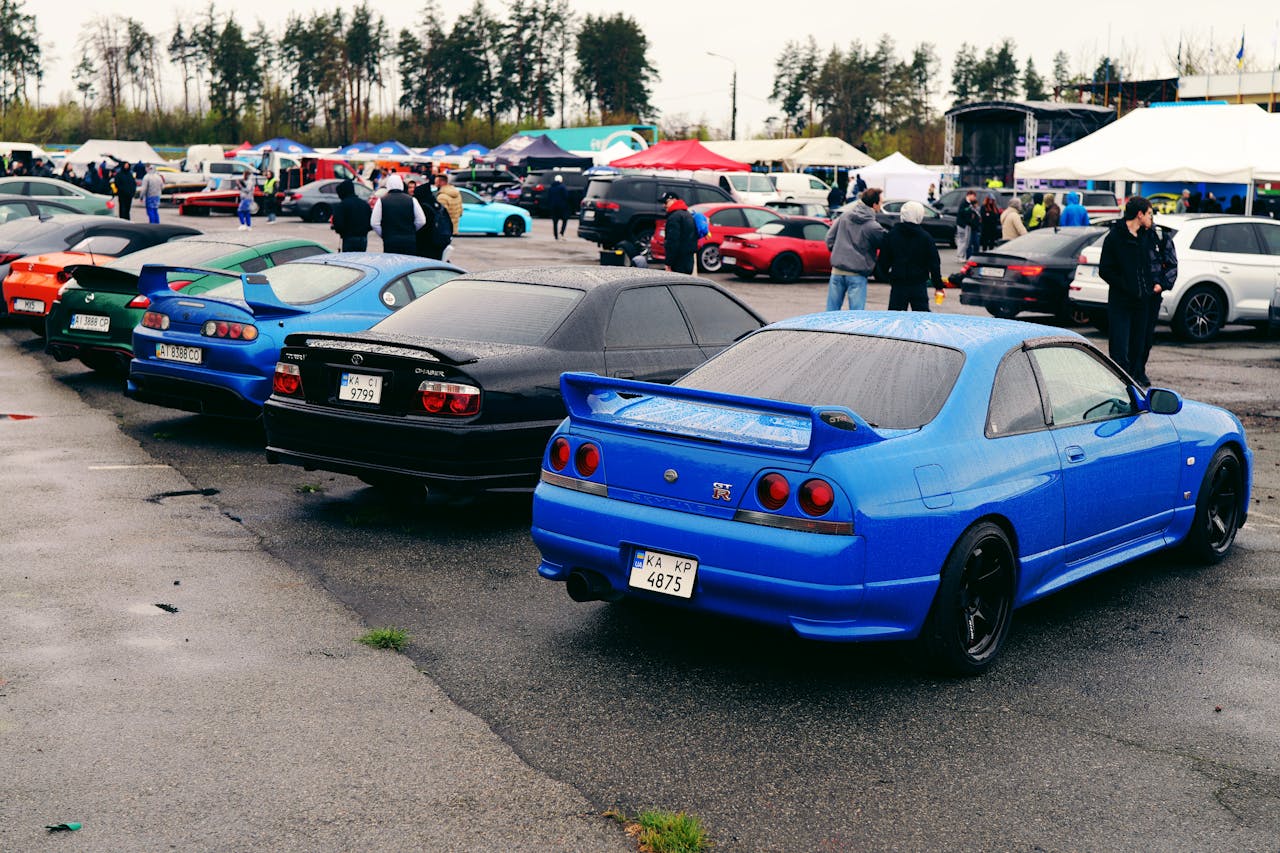 Vibrant car gathering in Ukraine showcasing a variety of colorful vehicles and enthusiasts.